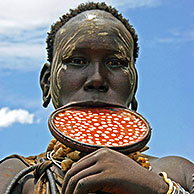 Mursi woman with large clay plate in lower lip, Omo Valley, Ethiopia, Africa 