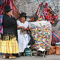Old women with traditional hats at market stall with souvenirs on display at the witch's market in La Paz, Bolivia