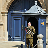 Tourist taking picture of guard in front of the Grand Ducal Palace / Palais grand-ducal at Luxembourg, Grand Duchy of Luxembourg