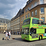 Tourists on sightseeing double decker bus and the Grand Ducal Palace / Palais grand-ducal at Luxembourg, Grand Duchy of Luxembourg